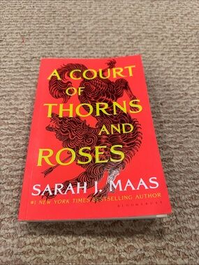 A Court of Thorns and Roses by Sarah J. Maas - Red Paperback